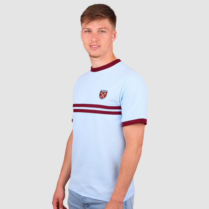 Ollie Scarles wearing West Ham Retro Pique Blue T-Shirt