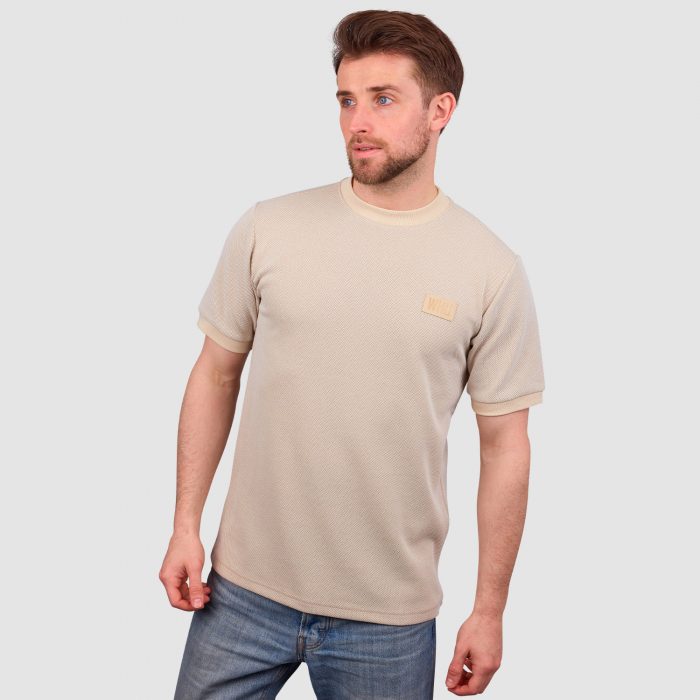 Man wearing West Ham Crucial Oat T-Shirt