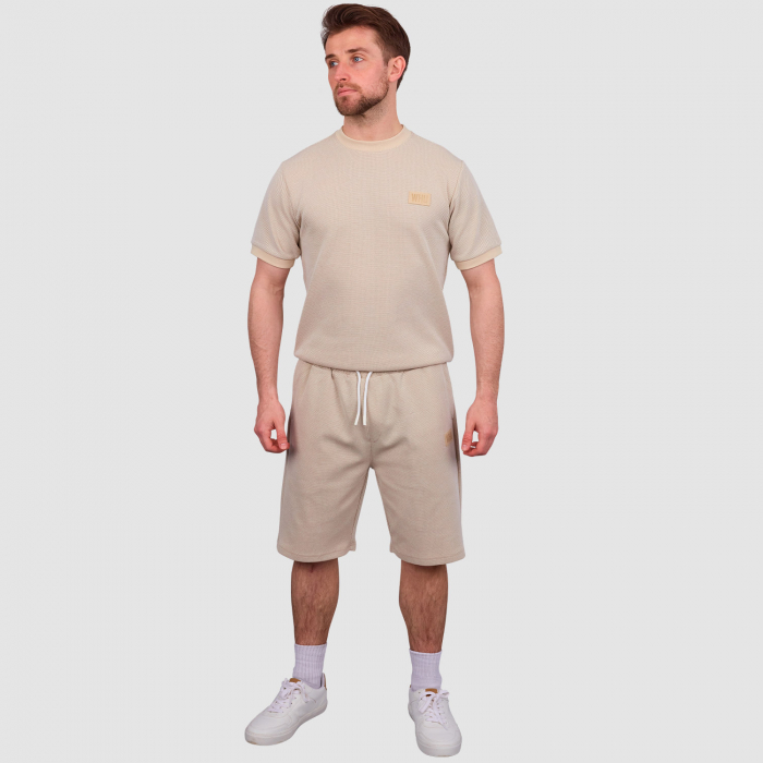 Model wearing West Ham Crucial Oat Shorts