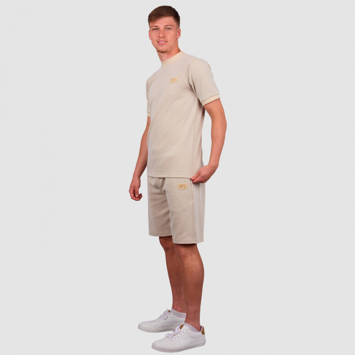 Ollie Scarles wearing West Ham Crucial Oat Shorts