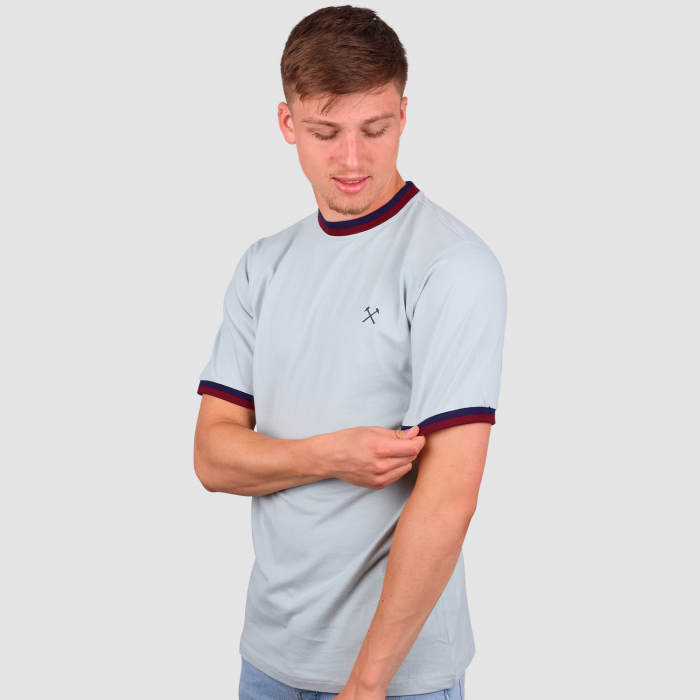 Ollie Scarles wearing West Ham Baby Blue T-Shirt