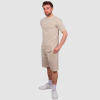 Man wearing West Ham Crucial Oat Shorts