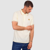 Man with West Ham Castle Collection Cream Polo